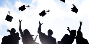 Silhouettes of Diverse International Students Celebrating Graduation