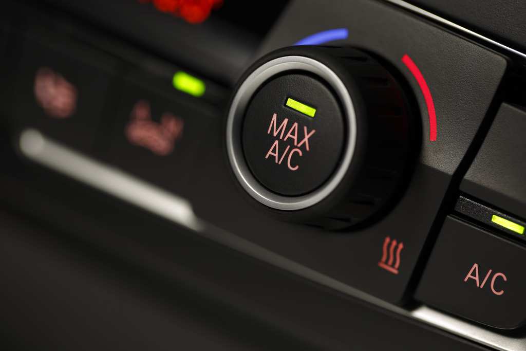 Color detail with the air conditioning button inside a car, shot with very shallow depth of field , Macro photography